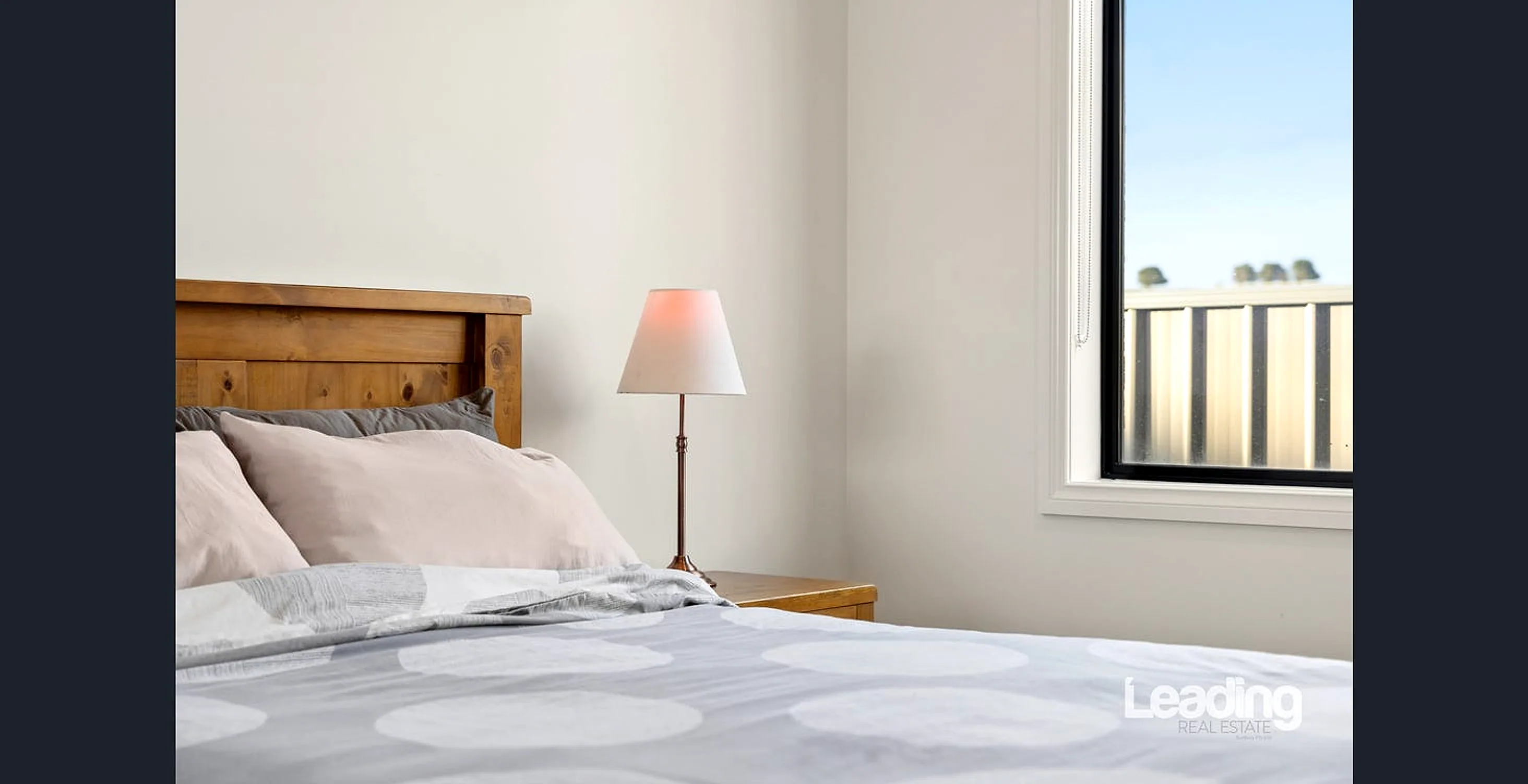 Second bedroom with built-in timber robes